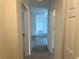 Apartment hallway with tile floors and doors to other rooms at 3724 Castle Pines Ln # 4237, Orlando, FL 32839