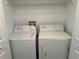 Stackable washer and dryer in a well-lit laundry closet at 3724 Castle Pines Ln # 4237, Orlando, FL 32839