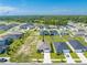 Aerial view of house, neighborhood, and surrounding landscape at 3842 Whitetail Ct, St Cloud, FL 34772