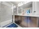 Elegant bathroom featuring double sinks and a shower at 3842 Whitetail Ct, St Cloud, FL 34772