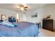 Spacious bedroom with ceiling fan and large bed at 3842 Whitetail Ct, St Cloud, FL 34772