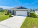 One-story home with brick and gray siding at 3842 Whitetail Ct, St Cloud, FL 34772