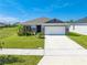 One-story home with red shutters and landscaping at 3842 Whitetail Ct, St Cloud, FL 34772