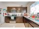 Well-equipped kitchen featuring dark wood cabinets at 3842 Whitetail Ct, St Cloud, FL 34772