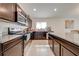 Modern kitchen with stainless steel appliances and granite counters at 3842 Whitetail Ct, St Cloud, FL 34772