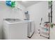 Clean laundry room, washer, dryer, and ample storage shelving at 3842 Whitetail Ct, St Cloud, FL 34772