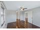 Well-lit bedroom with hardwood floors and ceiling fan at 4302 Clubside Dr # 4302, Longwood, FL 32779