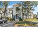 Two-story condo building with tree-lined parking lot at 4302 Clubside Dr # 4302, Longwood, FL 32779