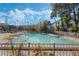 Sparkling community pool surrounded by lush landscaping and a relaxing patio at 4302 Clubside Dr # 4302, Longwood, FL 32779