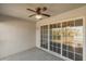 Bright screened balcony, featuring sliding glass doors and a ceiling fan at 4302 Clubside Dr # 4302, Longwood, FL 32779