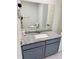 Bathroom vanity with granite countertop and gray cabinets at 4563 Yellowgold E Rd # 108, Kissimmee, FL 34746