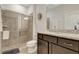 Bathroom with walk-in shower and granite vanity at 4587 Terrasonesta Dr, Davenport, FL 33837