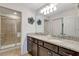 Double vanity bathroom with granite countertops at 4587 Terrasonesta Dr, Davenport, FL 33837