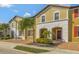 Two-story townhome with attractive facade and landscaping at 4587 Terrasonesta Dr, Davenport, FL 33837