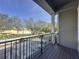 Balcony overlooking the parking lot and trees at 459 Windmill Palm Cir, Altamonte Springs, FL 32701