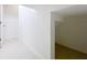 Small, functional closet with white walls and flooring at 459 Windmill Palm Cir, Altamonte Springs, FL 32701