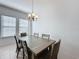 Dining room with wood table and chandelier at 459 Windmill Palm Cir, Altamonte Springs, FL 32701