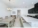 Modern kitchen with white quartz island and dark cabinets at 459 Windmill Palm Cir, Altamonte Springs, FL 32701