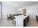 Modern kitchen with white quartz island and dark cabinets at 459 Windmill Palm Cir, Altamonte Springs, FL 32701