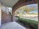 Brick patio with archway and view of landscaping at 459 Windmill Palm Cir, Altamonte Springs, FL 32701