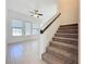 Carpeted staircase leading to the upper level of the home at 459 Windmill Palm Cir, Altamonte Springs, FL 32701