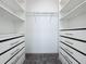 Large walk-in closet with ample shelving and drawers at 459 Windmill Palm Cir, Altamonte Springs, FL 32701