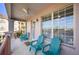 Private balcony with teal adirondack chairs at 5012 Shoreway Loop # 30307, Orlando, FL 32819