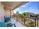 Relaxing balcony with teal chairs and view of the community at 5012 Shoreway Loop # 30307, Orlando, FL 32819