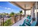 Covered balcony with teal chairs and a view of the street at 5012 Shoreway Loop # 30307, Orlando, FL 32819