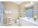 Clean bathroom with single sink vanity, shower/tub combo, and tile floors at 5012 Shoreway Loop # 30307, Orlando, FL 32819