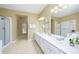 Double vanity bathroom with large mirror and shower at 5012 Shoreway Loop # 30307, Orlando, FL 32819