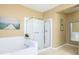 Bathroom with soaking tub, walk-in shower, and tile floors at 5012 Shoreway Loop # 30307, Orlando, FL 32819