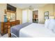 Main bedroom with a queen bed, dresser, and views into kitchenette at 5012 Shoreway Loop # 30307, Orlando, FL 32819