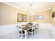 Elegant dining room with chandelier and wood table at 5012 Shoreway Loop # 30307, Orlando, FL 32819