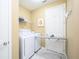 Convenient laundry room with washer, dryer, and ironing board at 5012 Shoreway Loop # 30307, Orlando, FL 32819