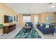 Living room with light walls and blue couches at 5012 Shoreway Loop # 30307, Orlando, FL 32819