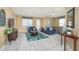 Living room with two blue sofas, coffee table, and access to balcony at 5012 Shoreway Loop # 30307, Orlando, FL 32819