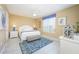 Spacious main bedroom with a king-size bed and ceiling fan at 5012 Shoreway Loop # 30307, Orlando, FL 32819