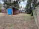 Backyard with shed, playset and wooden fence at 560 Garden Heights Dr, Winter Garden, FL 34787