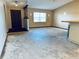 Living room with entryway and view into kitchen at 560 Garden Heights Dr, Winter Garden, FL 34787