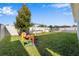 Large backyard with grassy area and playset at 568 Seattle Slew Dr, Davenport, FL 33837