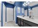 Double vanity bathroom with dark wood cabinets and quartz countertops at 568 Seattle Slew Dr, Davenport, FL 33837