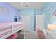 bedroom with loft bed, desk, and soft pink decor at 568 Seattle Slew Dr, Davenport, FL 33837