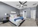 Bedroom with ceiling fan and gray walls at 568 Seattle Slew Dr, Davenport, FL 33837