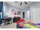 bedroom with Marvel theme, twin bed, and desk at 568 Seattle Slew Dr, Davenport, FL 33837