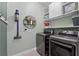 Laundry room with washer, dryer, and ample shelving at 568 Seattle Slew Dr, Davenport, FL 33837