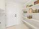 White pantry with ample shelving and storage at 6230 Chorus Dr, Mascotte, FL 34753