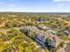 Aerial view of community and surrounding landscape at 6413 Astor Village Ave # 313, Orlando, FL 32835