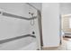 Clean and modern bathroom with tub and shower combination at 6413 Astor Village Ave # 313, Orlando, FL 32835