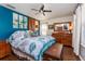 Main bedroom with a wooden dresser and blue accent wall at 757 Siena Palm Dr # 757, Celebration, FL 34747